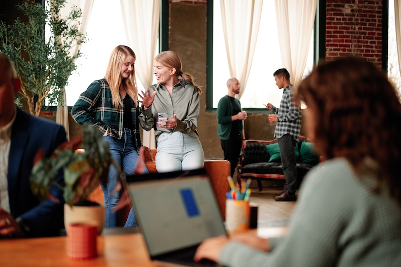 The Formada team, a full-service medical marketing agency, discusses strategy while being photographed in a studio.