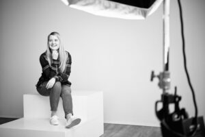 VP of Content, Natalie Bufton, discusses healthcare marketing and content ownership while seated and shot in black and white.