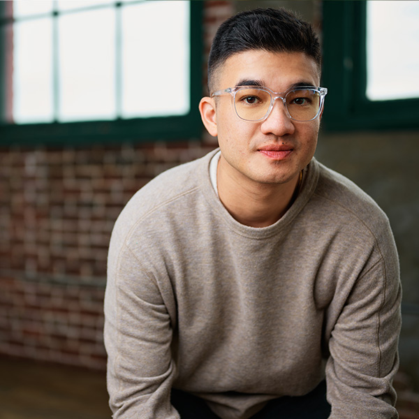 Formada VP of Paid Media, Harrison Horblit, smiles in front of a brick office wall